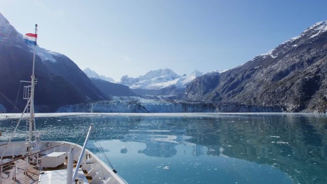 Cruise ship in Glacier Bay cruising towards Johns Hopkins Glacier in Alaska, USA. RED EPIC SLOW MOTION.