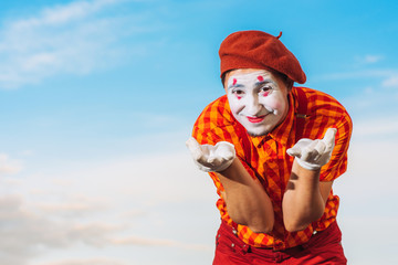 Mime shows pantomime against the blue sky