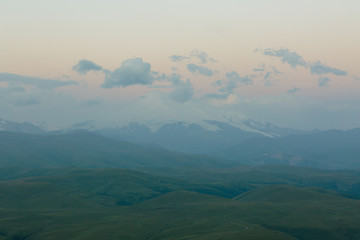 Fototapeta premium Russia, Republic of Kabardino-Balkaria, time lapse. Summer in the mountains of the Caucasus. Formation and movement of clouds over mountains peaks.