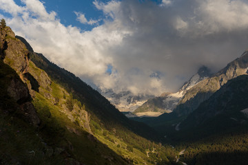 Fototapeta premium Russia, Republic of Kabardino-Balkaria, time lapse. Summer in the mountains of the Caucasus. Formation and movement of clouds over mountains peaks.