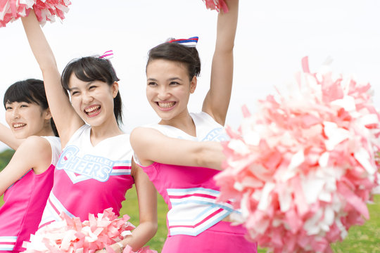Three Cheerleaders  Cheering with Pom Pom