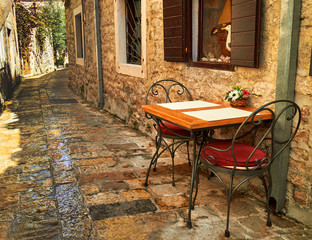 coffee table in a narrow street