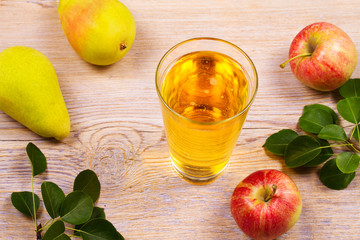 Glass of cider with apples and pears. Cider with fruits. Food and drink concept