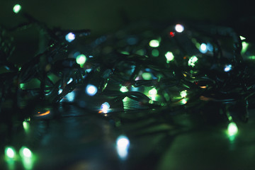 Fototapeta na wymiar Christmas lights on wooden table.
