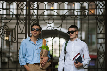 Modern students life. Stylish young men. Two confident males outdoors, hipsters healthy lifestyle