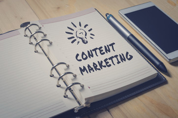 Fototapeta premium Handwriting of Content Marketing word in notebook for website content concept