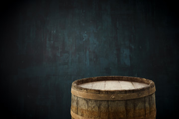 background of barrel and worn old table of wood.