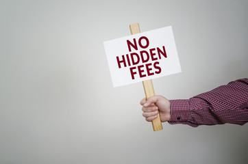 Poster in hand, business concept with text No Hidden Fees