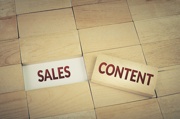 Sales and content marketing concept with wooden blocks