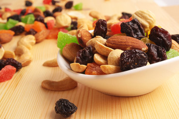 Dried fruits on a wooden background