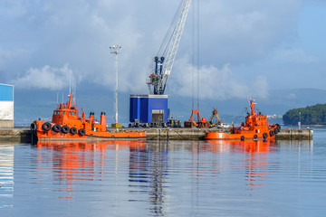 Fototapeta premium orange tug on the dock