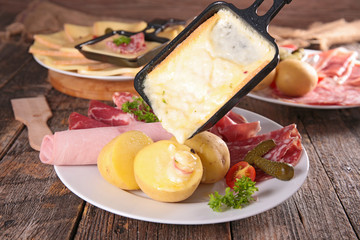 raclette cheese melted on potato