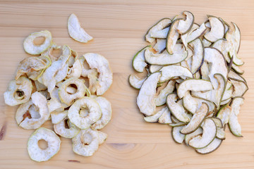 Ripe organic and dried pears on a wooden table, top view.