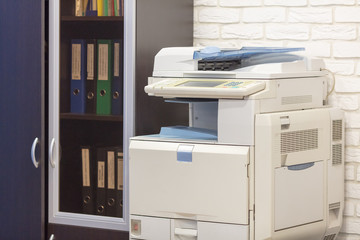 big multifunction printer in office near wall - 171434669