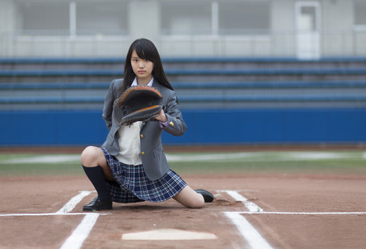 Portrait of a student with catchers mitt ready to catch ball