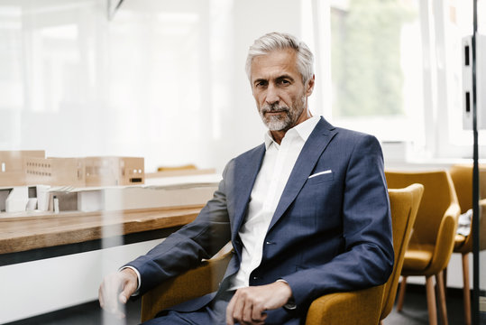 Portrait of confident mature businessman in office