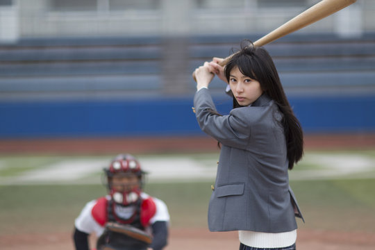 The female student who does the style struck with a baseball bat