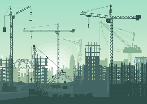 Tower cranes on construction site. Buildings under construction.