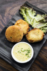 fried fish cakes with garlic butter sauce snack