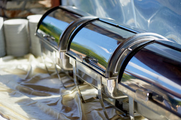 Buffet Table with dishware waiting for guests nobody