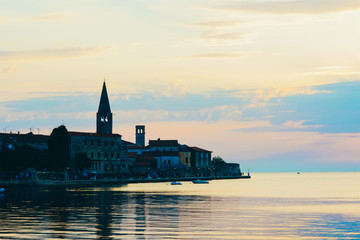 Fototapeta premium Sunset on the seashore. City View Walk along the seafront
