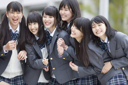 Portrait of high school girls laughing