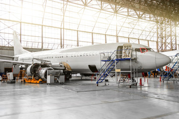 Aircraft in the hangar in the maintenance of plating, interior, engine repair