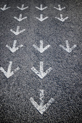 Arrows on asphalt