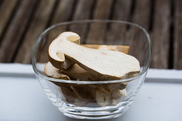 Stone mushrooms halved in a glass bowl