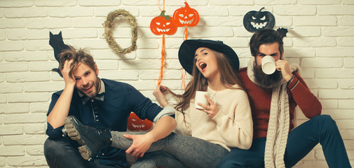 Halloween men in casual wear sitting on floor