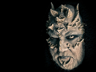 Fototapeta premium Man with dragon skin and grey beard