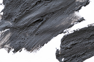 Black volcanic cosmetic clay texture close up. solution of cosmetic clay abstract background