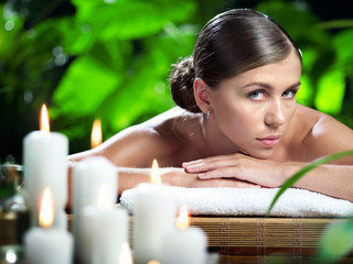 portrait of young beautiful woman in spa environment.  