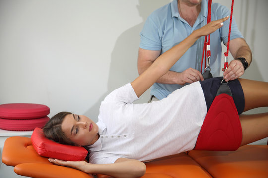 Physiotherapy: Treatment of pain in the spine with Red Cord equipment.