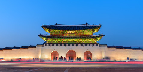 Gyeongbokgung Palace At Night In South Korea, with the name of the palace 'Gyeongbokgung' on a sign