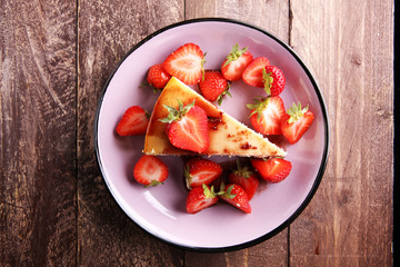 Homemade cheesecake with fresh strawberries and mint for dessert - healthy organic summer dessert pie cheesecake. Vanilla Cheese Cake.