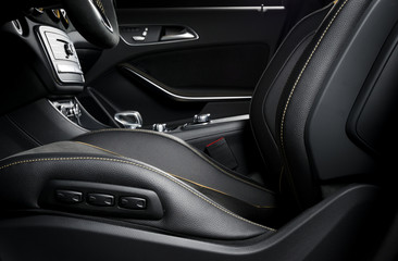 Obraz na płótnie Canvas Modern car race interior, black leather with yellow stitch