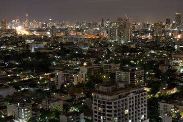 Fototapeta na wymiar Bangkok city scrapers with high building at night time