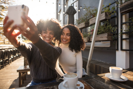 Two Young Women Taking A Selfie