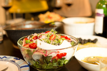 Fresh vegetable salad in glass bowl with salad sauce
