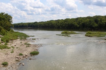 A sunny day at the park near the river.
