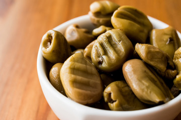 Grilled Green Olives in a bowl.