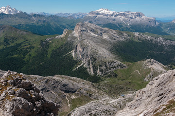 Fototapeta na wymiar Mountain Ridge with Big Stone among Barren Mountains in Italian Dolomites Alps in Summer Time