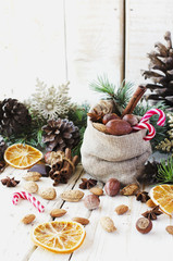 New Year or Christmas composition with walnuts, mulled wine, hazelnuts