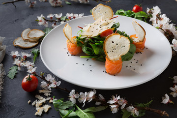 Restaurant dish on white plate on black background