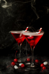 Fruit liqueur or apirol, Martini Bianco with cherries cocktail