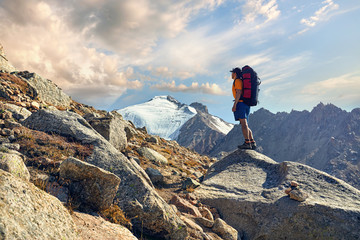 Hiker with backpack in the mountains
