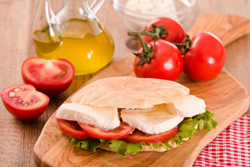 Puccia bread with mozzarella and tomato. 