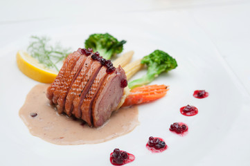 Roasted duck breast with cranberry and cream sauce