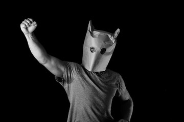 Photo of man with a paper bag on his head